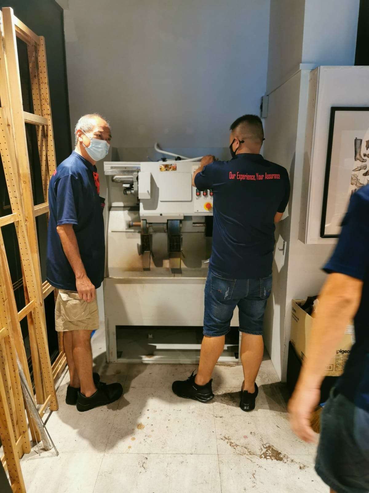 movers preparing industrial equipment