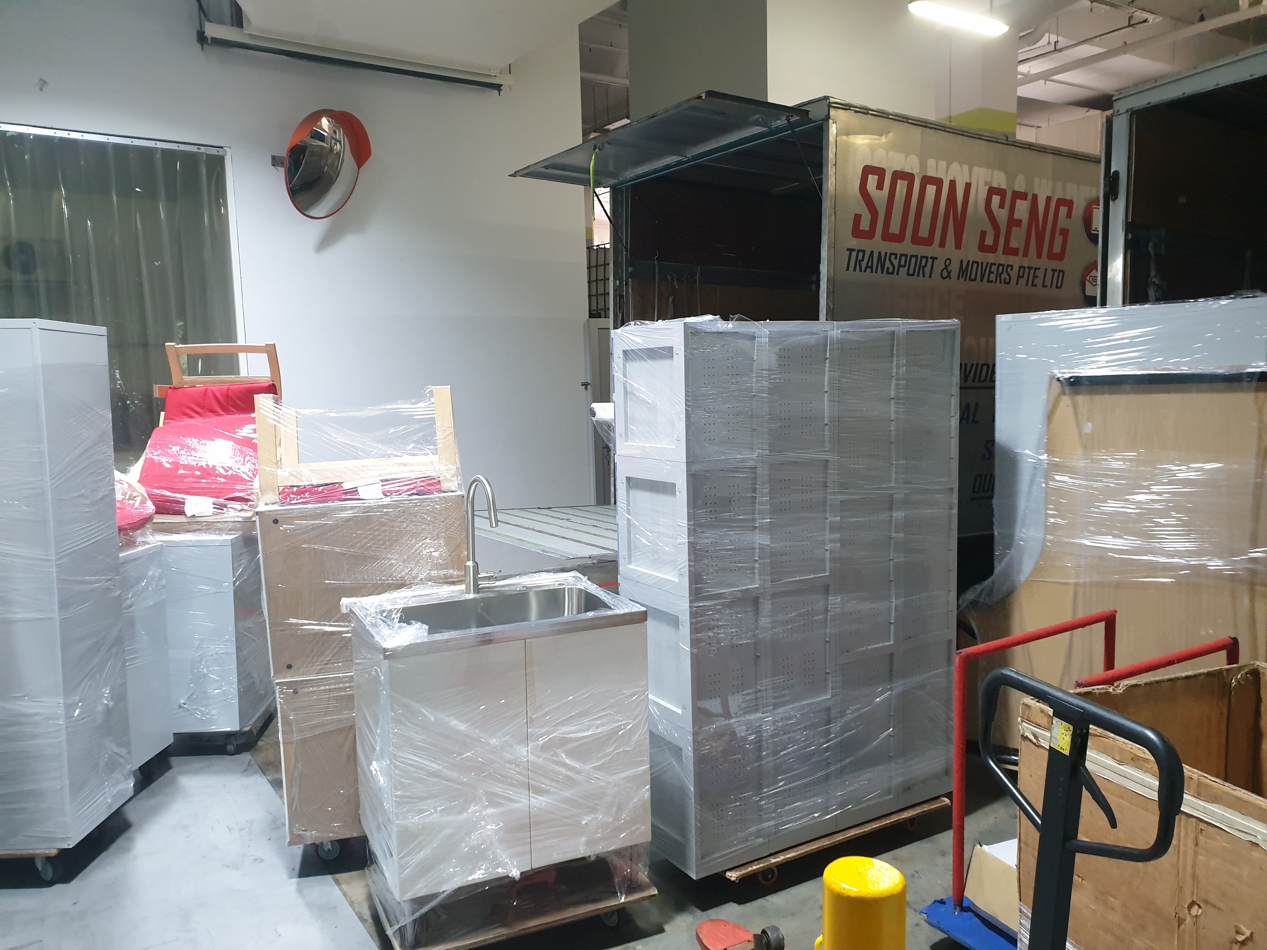 loading commercial equipments inside truck