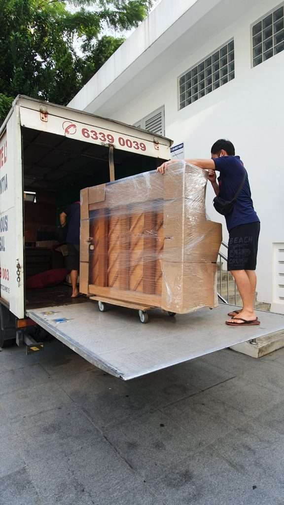loading piano into a truck