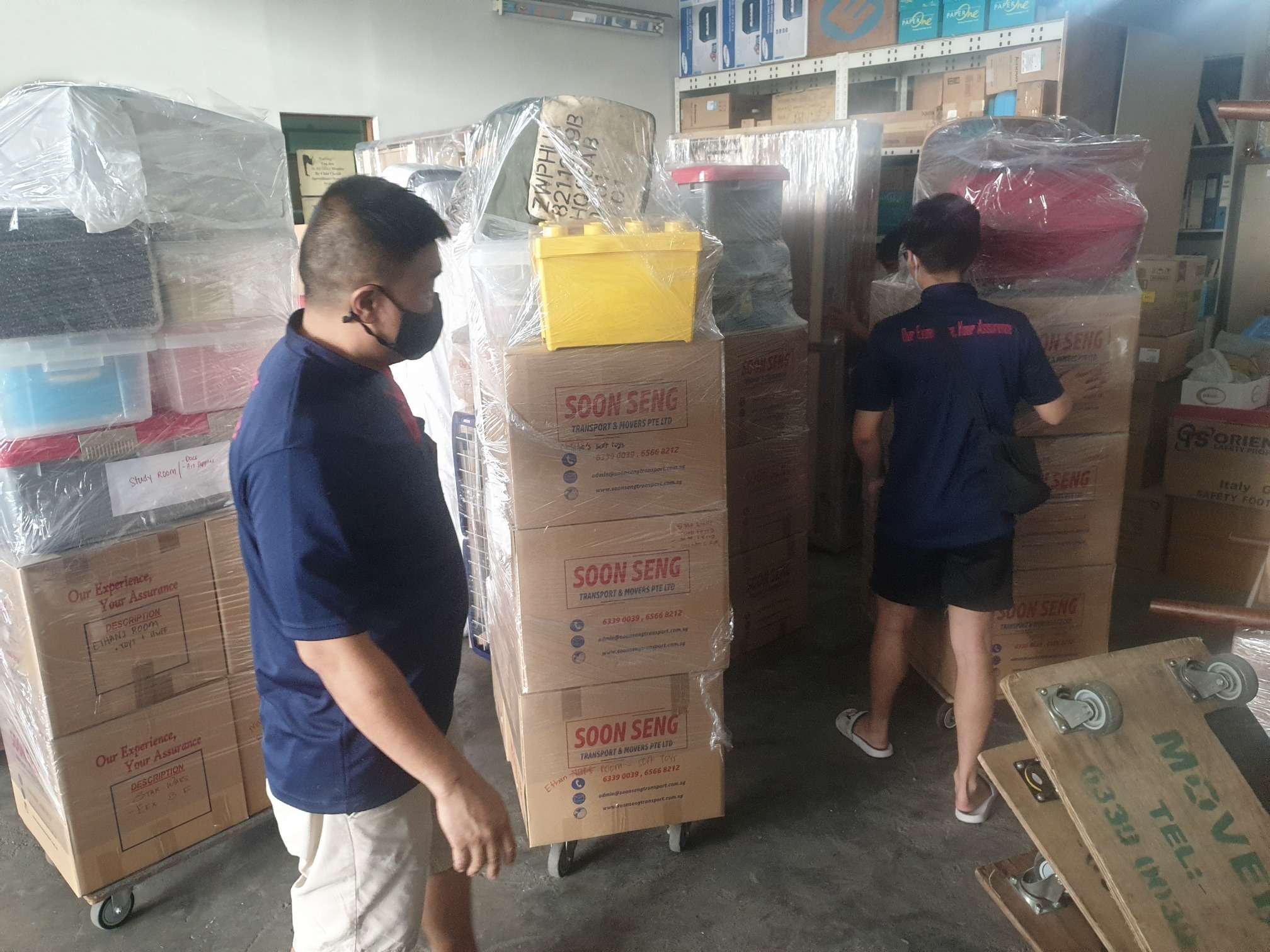 two men sorting and moving office stuff