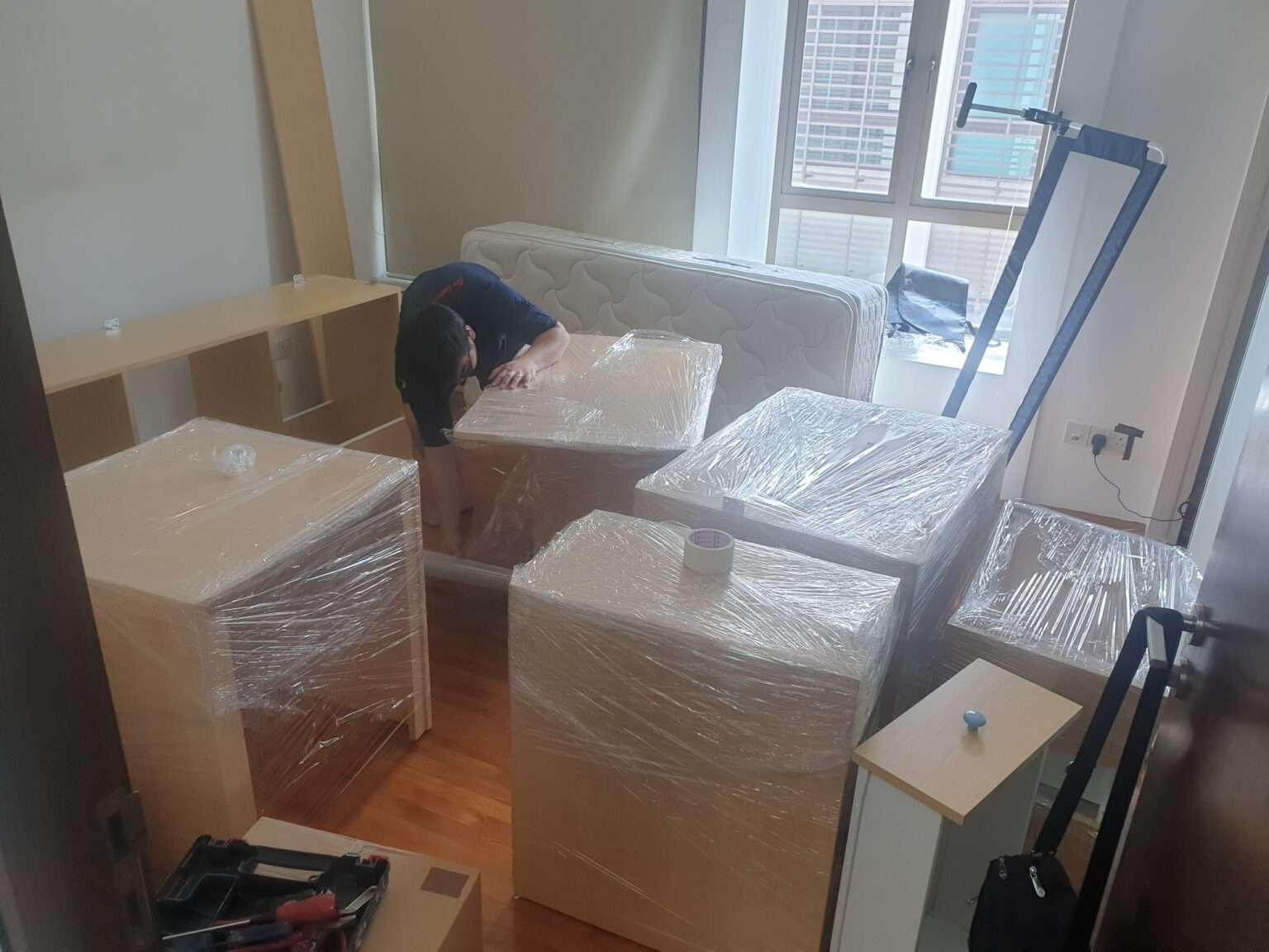 professional mover packing all furniture before moving