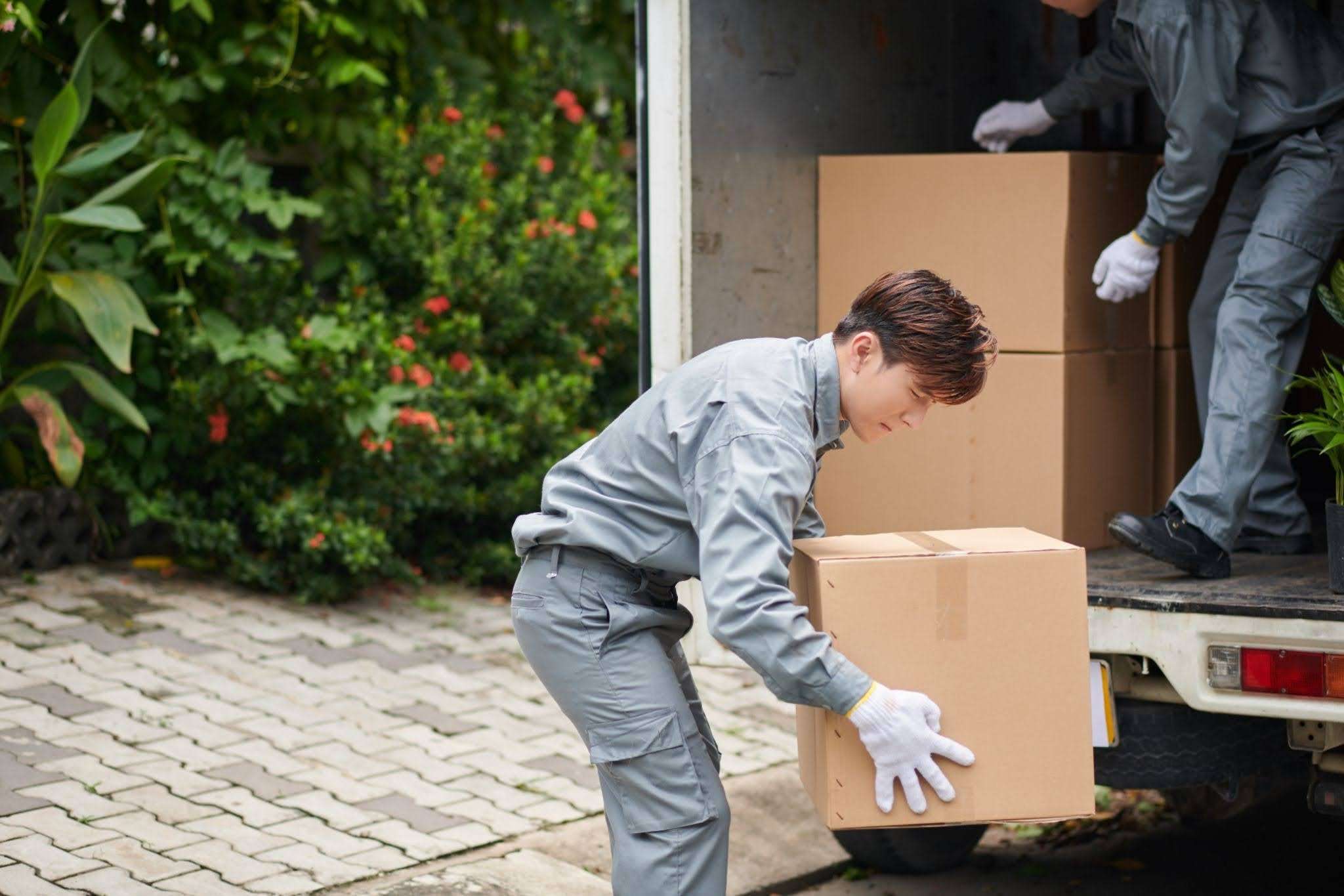 movers loading boxes into truck